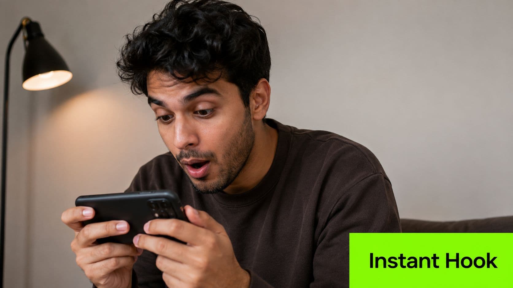 A young man with a surprised expression holds his smartphone while viewing viral YouTube Shorts content.