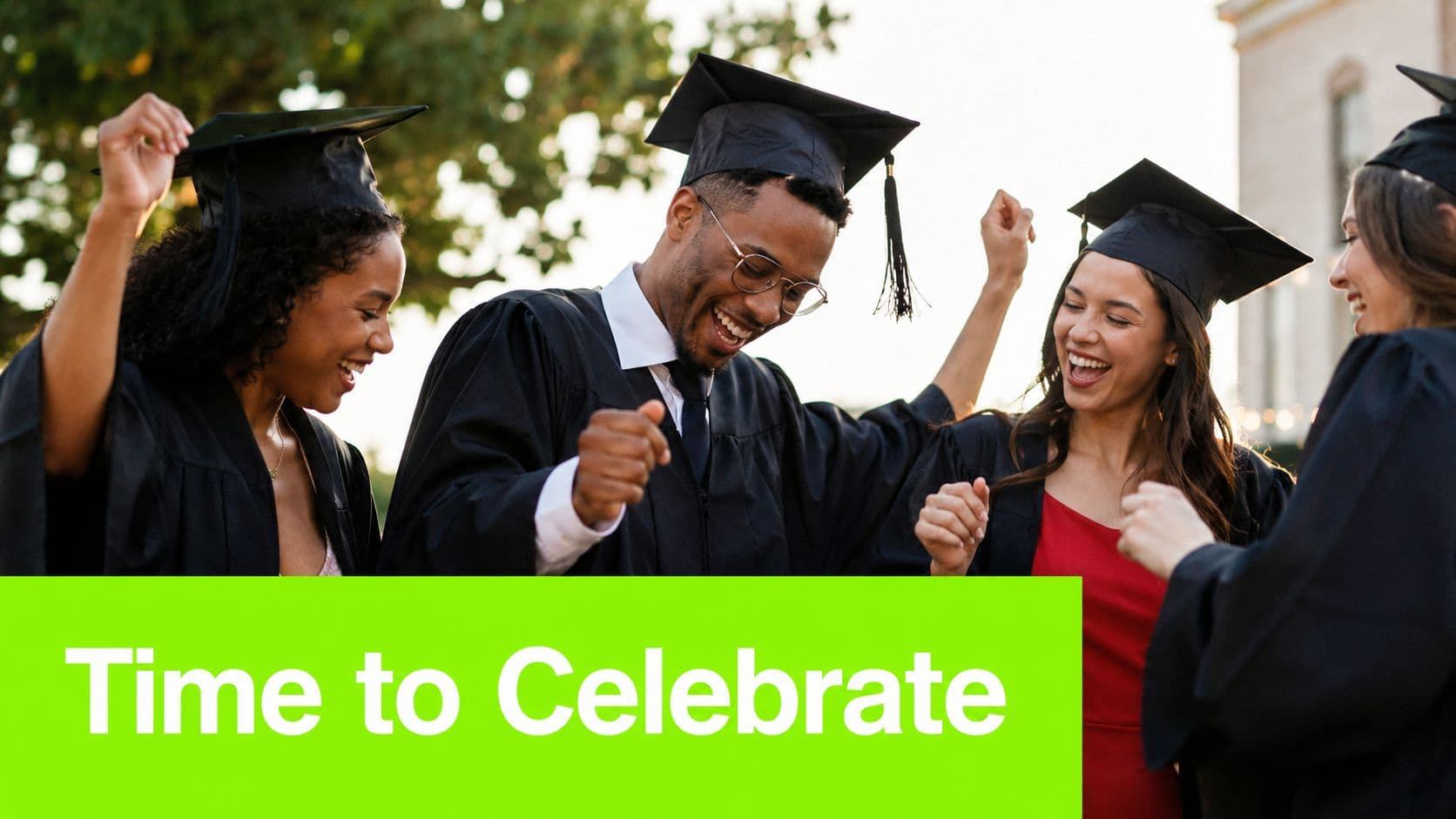 A group of happy graduates in caps and gowns laughing and cheering during their graduation celebration.