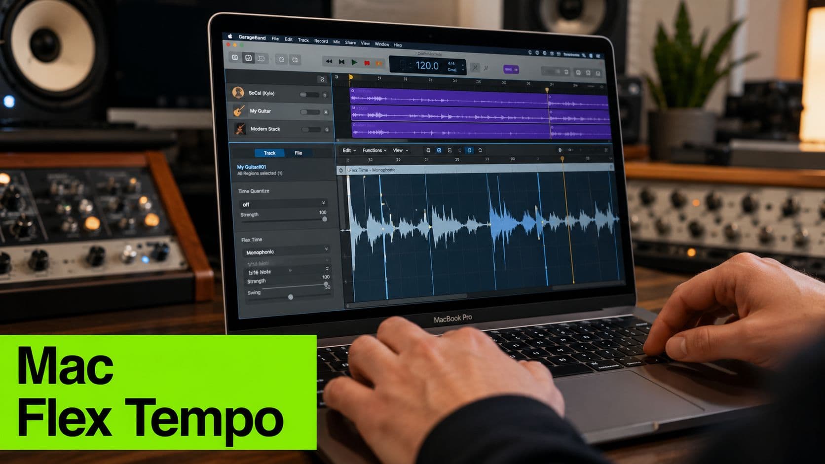 A close-up view of a person using a MacBook Pro to adjust audio tracks in GarageBand software.